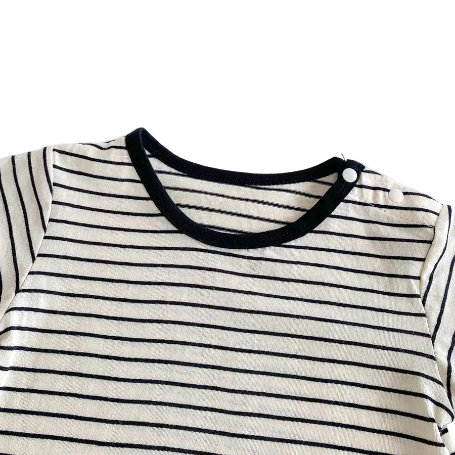 Close up of the round, black-trimmed neckline on the baby boy Breton-stripe short-sleeve t-shirt.
