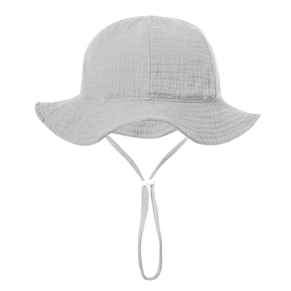 Light grey neutral unisex baby beach hat in soft woven cotton.