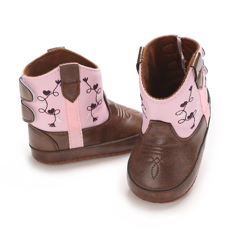 Rear view of infant pink cowboy boots showing the easy-on side pull tabs and heel structure.