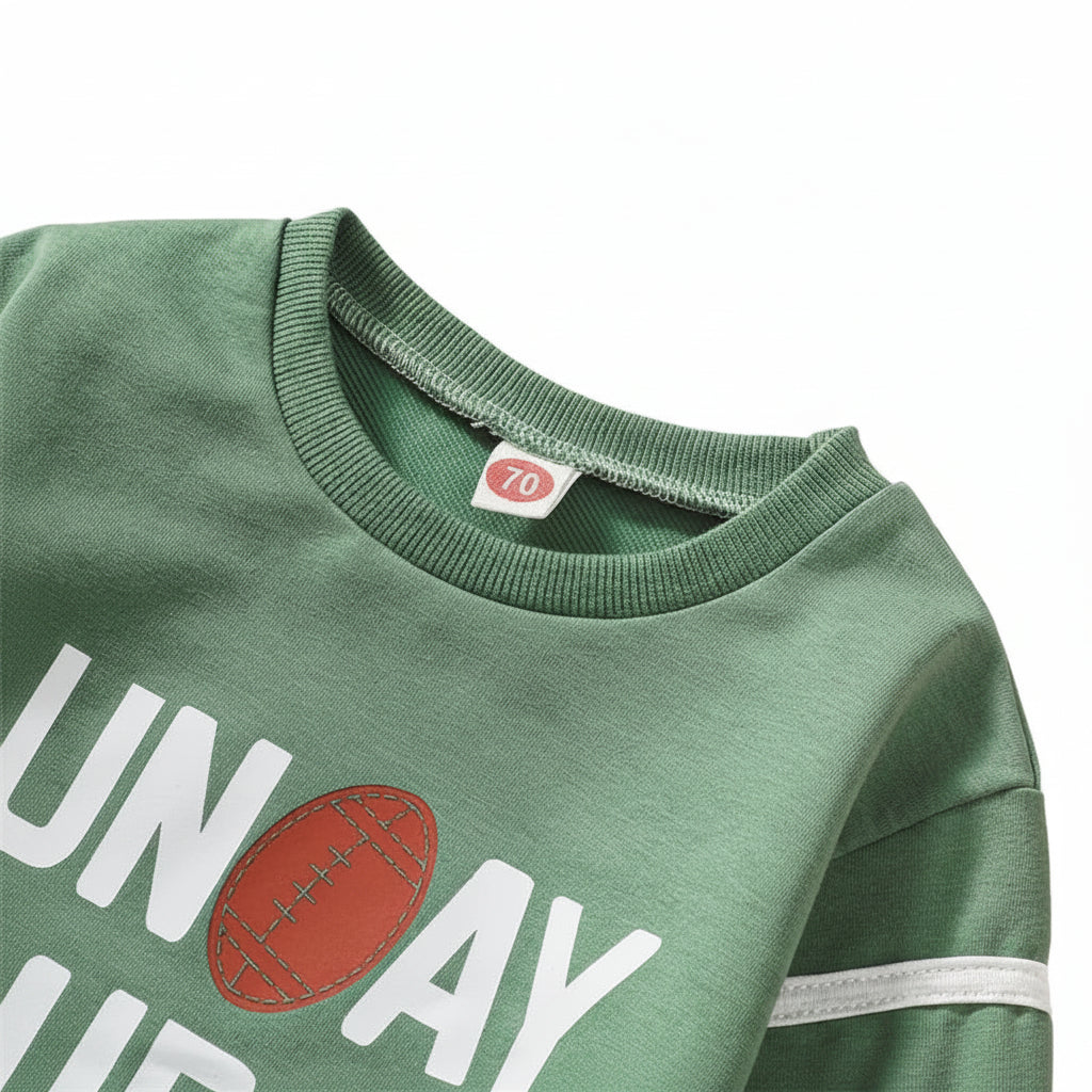 Detailed view of the flexible ribbed crew neck collar and inner neckline stitching on the sage green baby pullover.