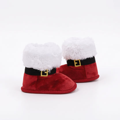 Side view of baby plush red Santa boots with black buckle strap and soft fuzzy cuffs