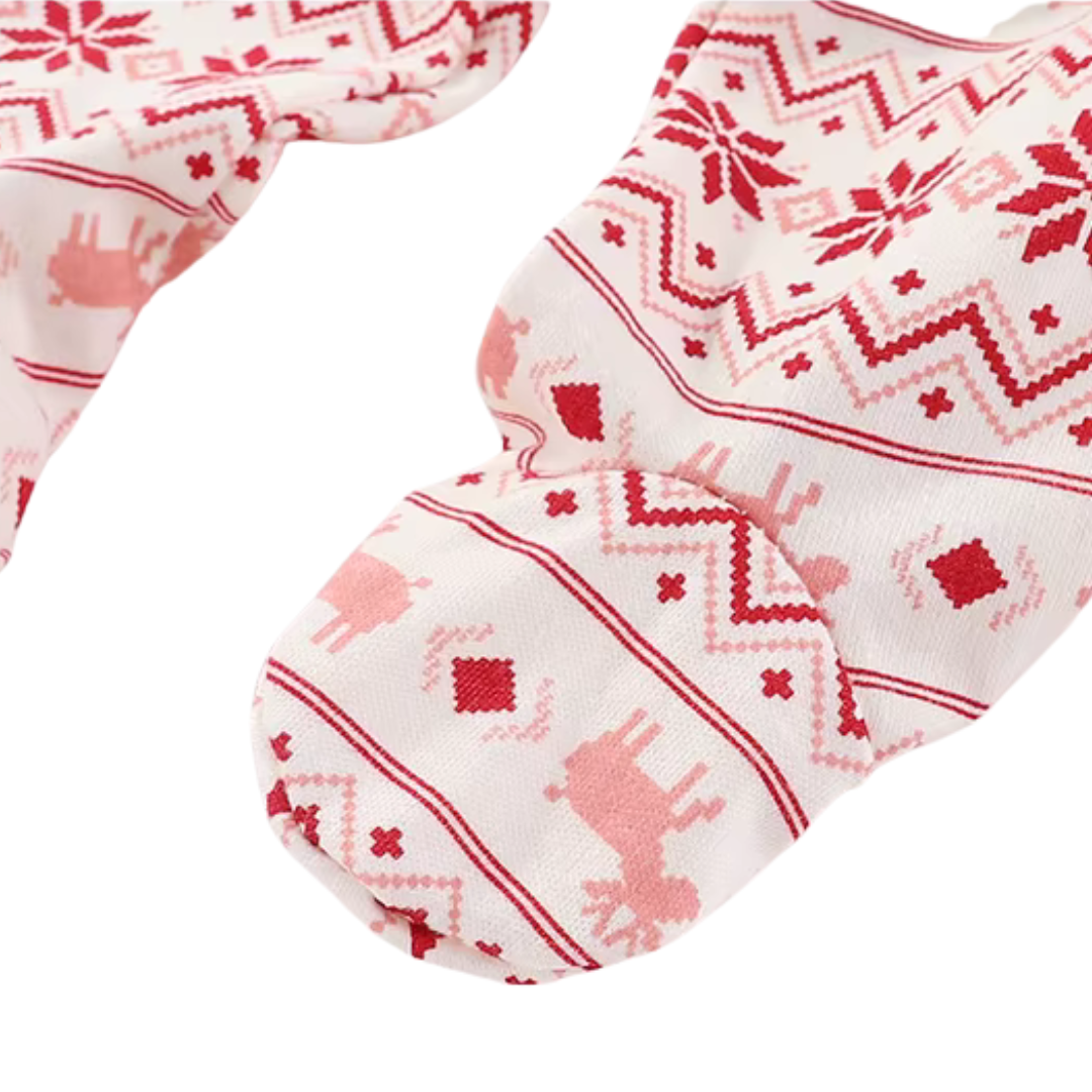 Close-up view of sewn footie bottom on baby holiday pants showing foot coverage