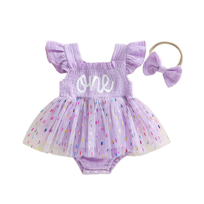 Lavender baby girl 1st birthday confetti tutu romper with matching elastic bow headband.