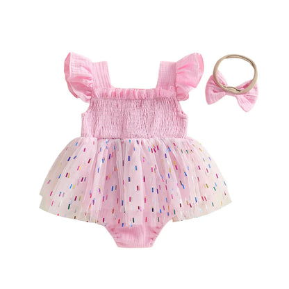 Back view of pink baby girl 1st birthday confetti tutu romper with matching elastic bow headband.