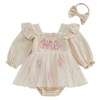 Beige cream baby girl 1st birthday long sleeve smocked romper dress with pink embroidered ONE text and matching headband