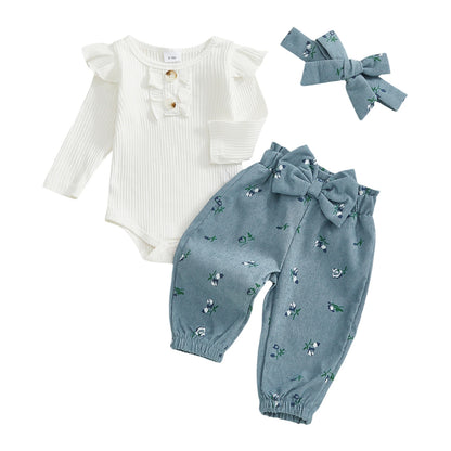 Baby girl 3-piece fall outfit set featuring a white ribbed long-sleeve romper, dusty blue floral corduroy pants, and matching bow headband.