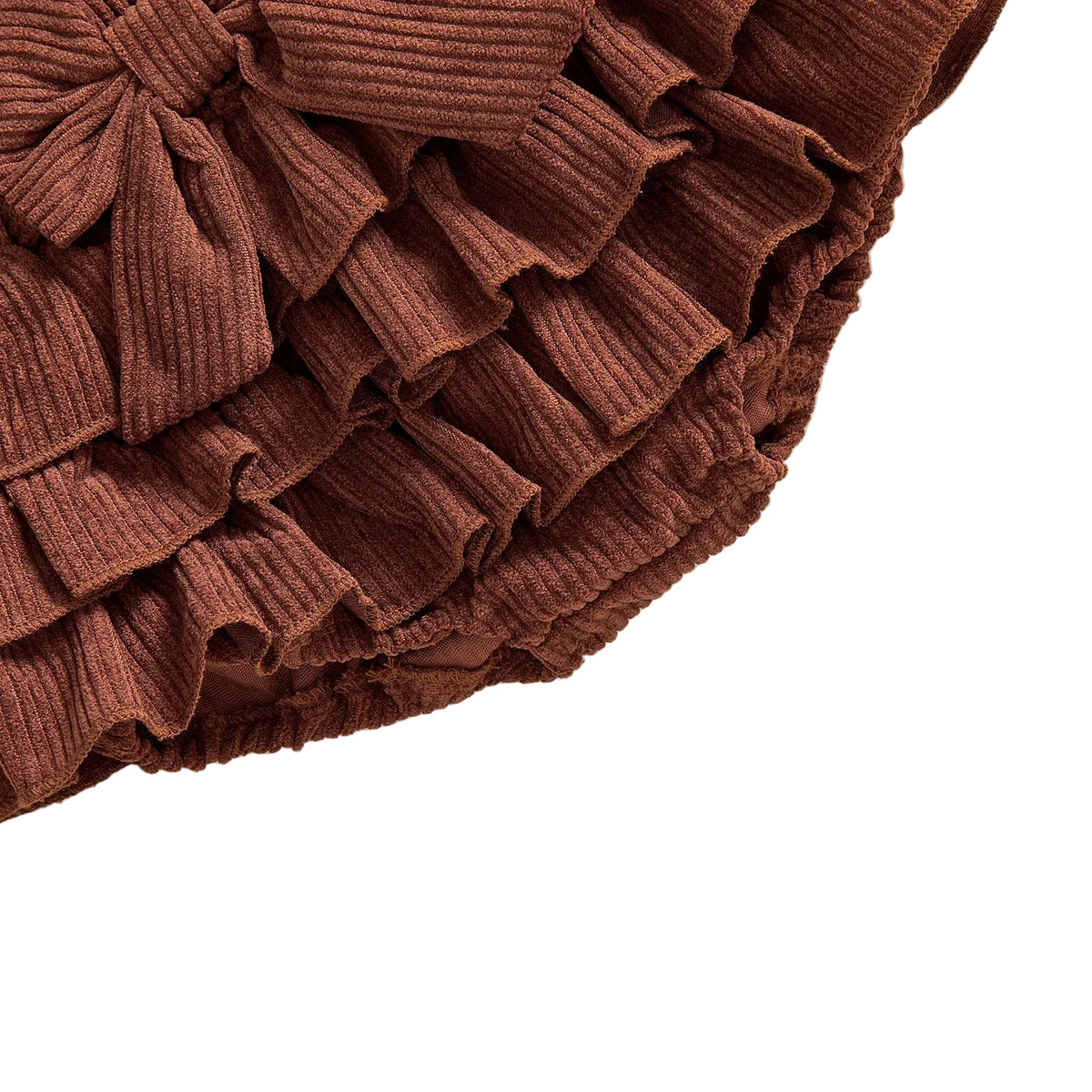 Close-up view of tiered ruffle layers on baby girl corduroy bloomers