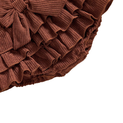Close-up view of tiered ruffle layers on baby girl corduroy bloomers