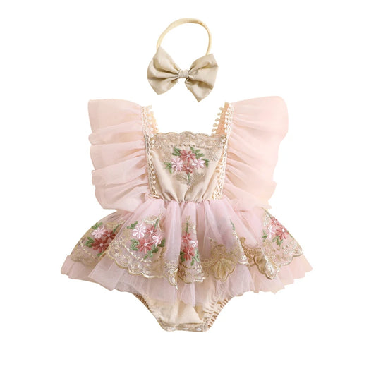 Front view of a baby girl pink tulle romper with 3D floral embroidery, ruffled fairy fly sleeves, and a matching bow headband on a clean white background.