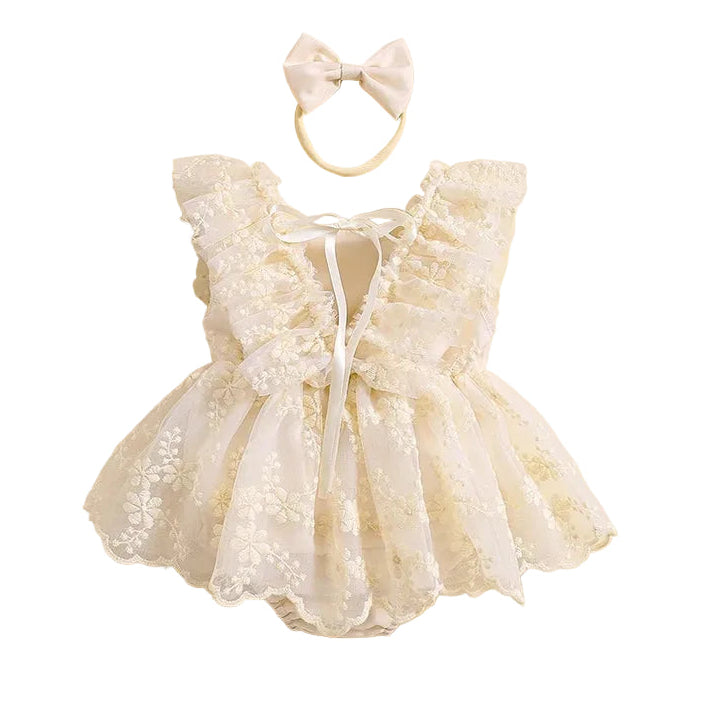 Back view of cream baby floral lace romper dress showing lace tie details and ruffle sleeves