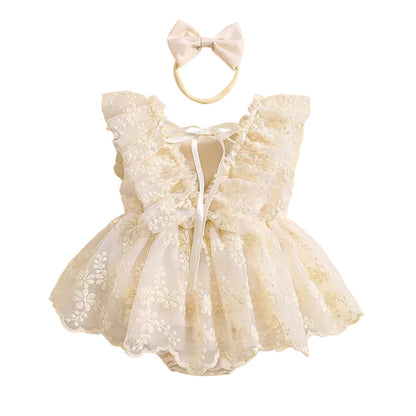 Back view of cream baby floral lace romper dress showing lace tie details and ruffle sleeves
