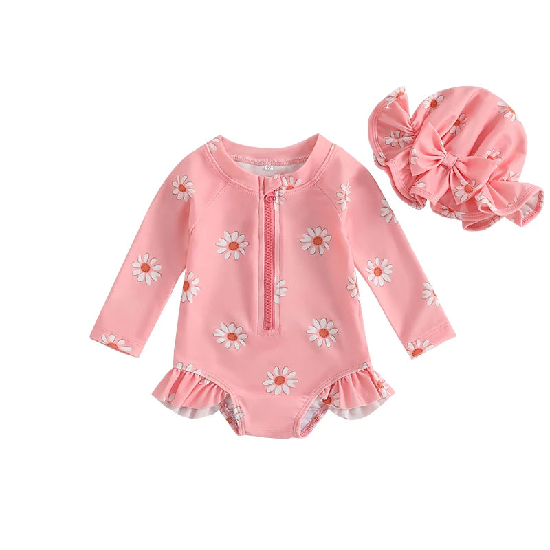 Dusty rose pink baby girl long sleeve swimsuit with daisy flower pattern, front zipper, and coordinating pink sun hat.