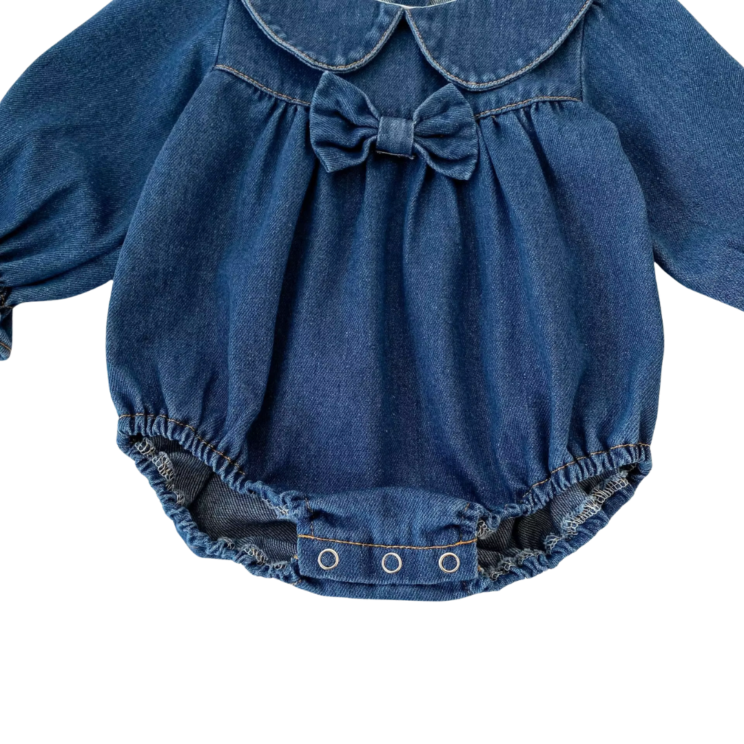 Full front view of dark blue baby girl long sleeve denim bubble romper