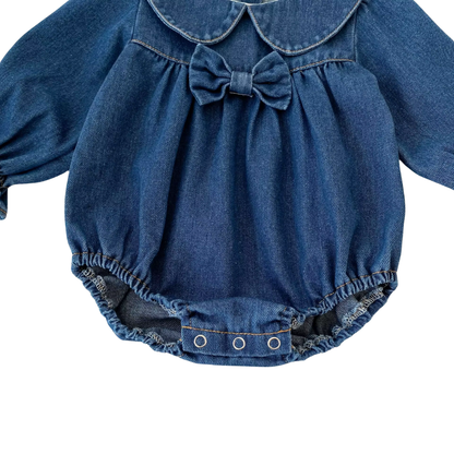 Full front view of dark blue baby girl long sleeve denim bubble romper