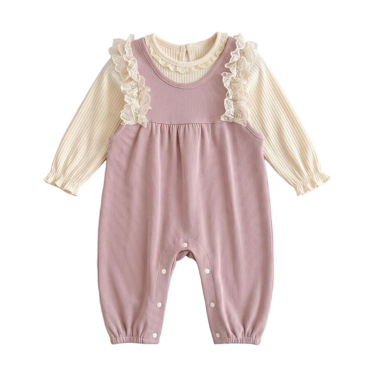 Two-piece baby girl outfit flat lay featuring a dusty pink ribbed lace ruffle suspender romper and cream long-sleeve top