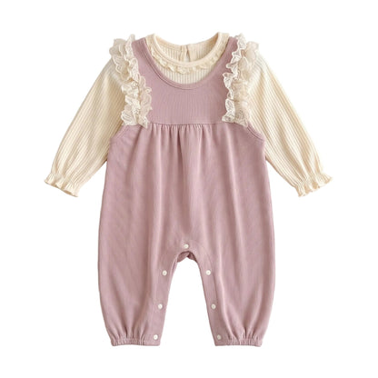 Two-piece baby girl outfit flat lay featuring a dusty pink ribbed lace ruffle suspender romper and cream long-sleeve top