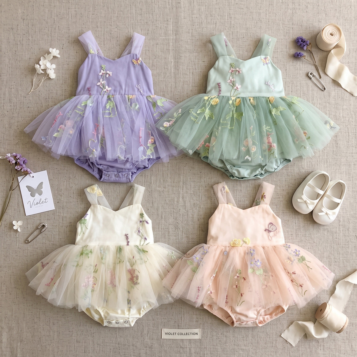 Baby girl fairy tulle tutu romper dresses in lavender, sage green, ivory, and pink.