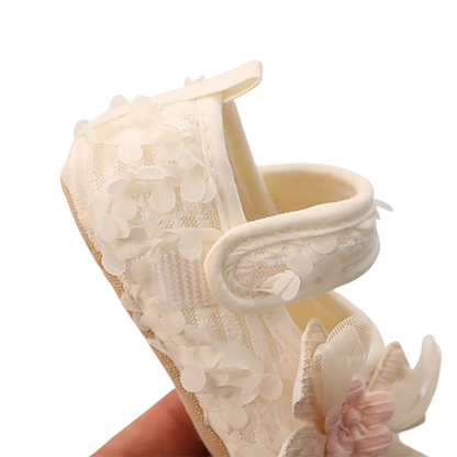 Side view of Kidsely baby girl floral flat showing the easy hook and loop velcro strap closure.