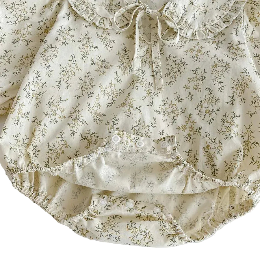 Close-up of the bottom reinforced snap buttons for easy diaper changes on the Kidsely cotton baby girl romper.