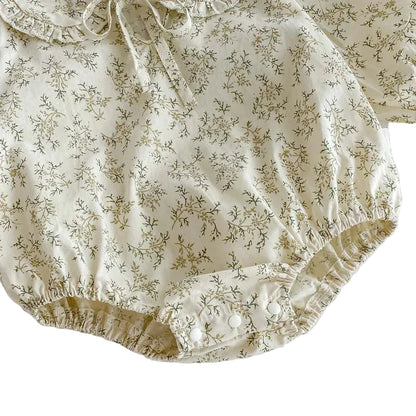 Detail shot of the gathered elastic leg opening on the Kidsely floral baby girl bubble romper.