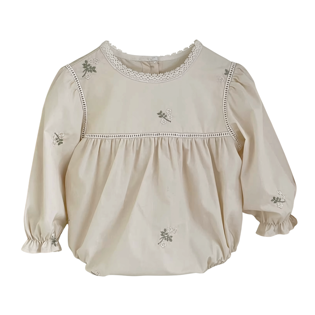Front view of cream baby girl long sleeve bubble romper with floral embroidery and lace collar detail
