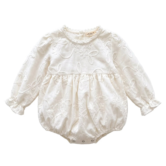 White baby girl long sleeve floral embroidered bubble romper displayed on a clean white background.