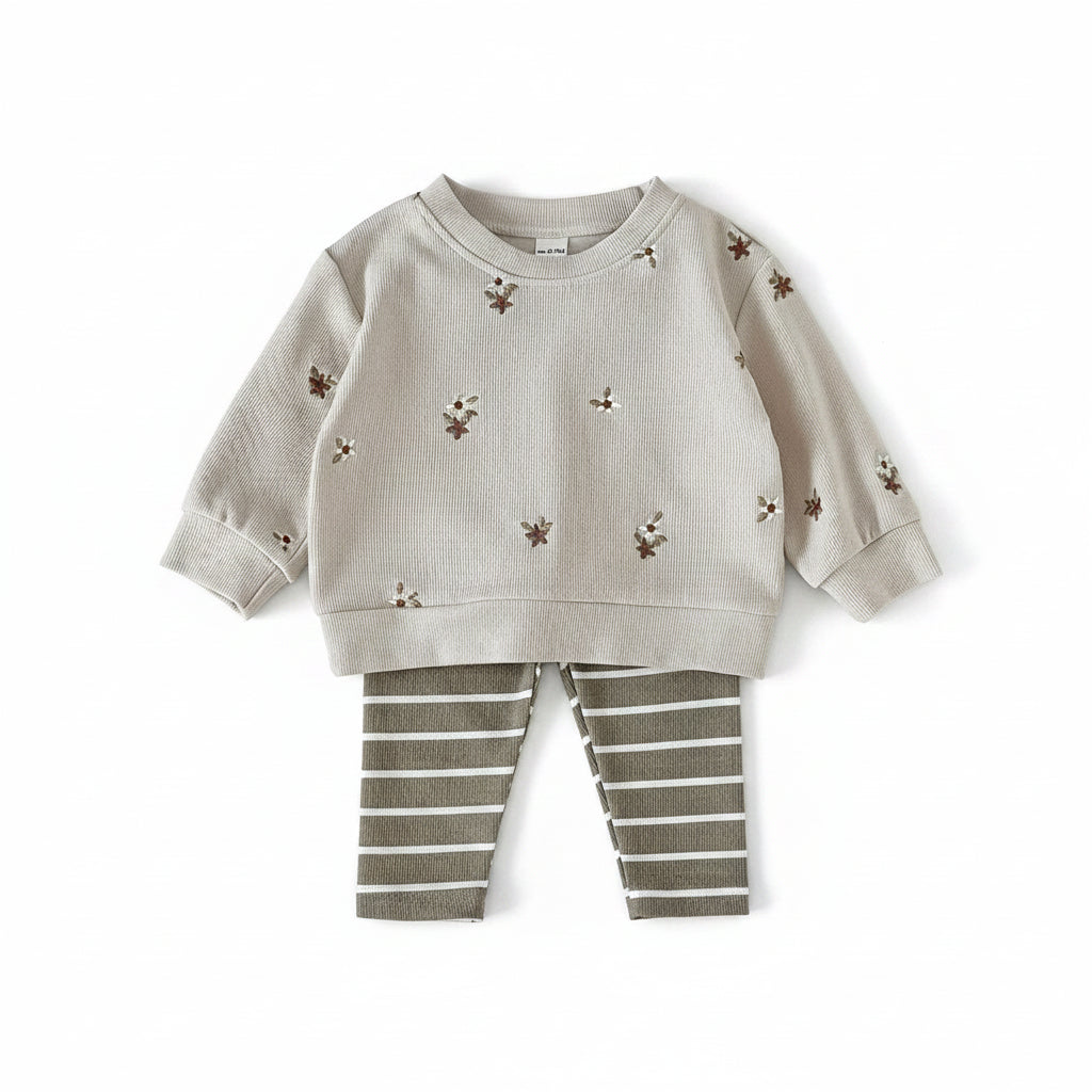 Baby and toddler girl 2-piece outfit set featuring a cream ribbed floral embroidered sweatshirt and olive green striped pants.