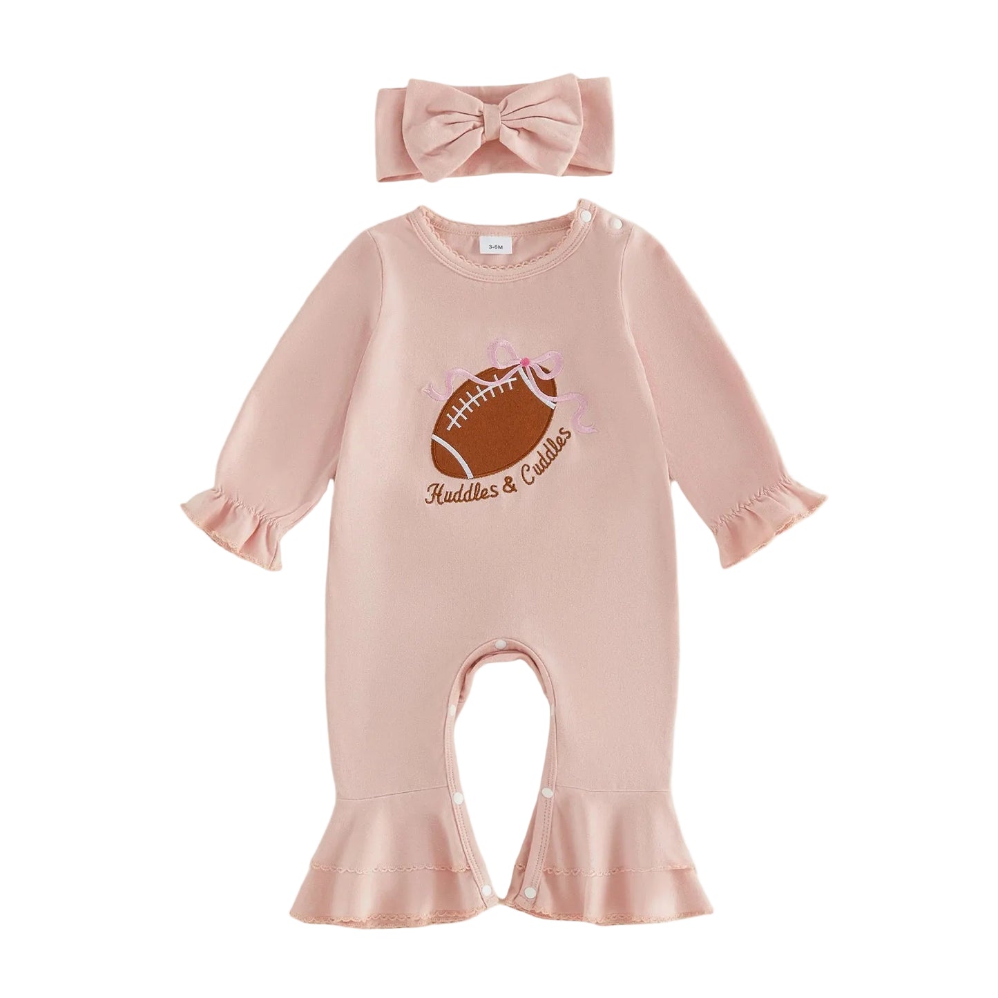 Flat lay of a baby girl pink long-sleeve jumpsuit featuring a football embroidery and matching bow headband.