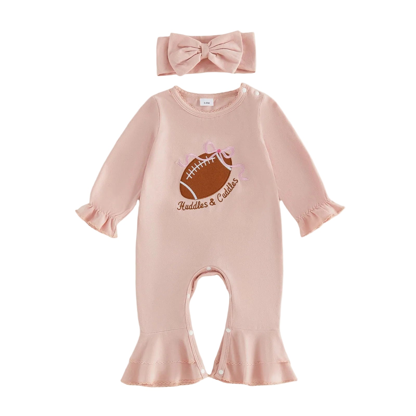 Flat lay of a baby girl pink long-sleeve jumpsuit featuring a football embroidery and matching bow headband.