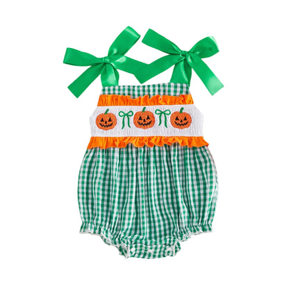 Baby girl green gingham smocked bubble romper featuring green shoulder ribbons and jack-o-lantern Halloween embroidery.