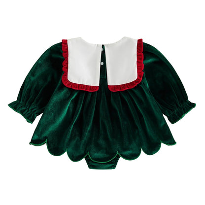 Back view of baby girl green velvet Christmas romper dress featuring white scalloped bib collar and back closure buttons