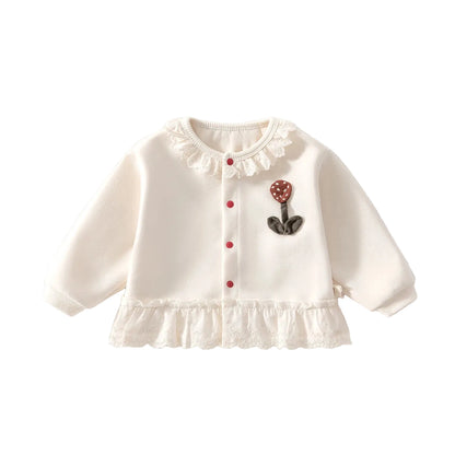 Ivory white baby and toddler girl knit cardigan sweater featuring a 3D floral applique and delicate lace trim collar and hem.