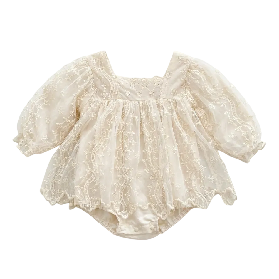 Full front view of a baby girl long sleeve ivory lace romper with a square neckline against a white background.