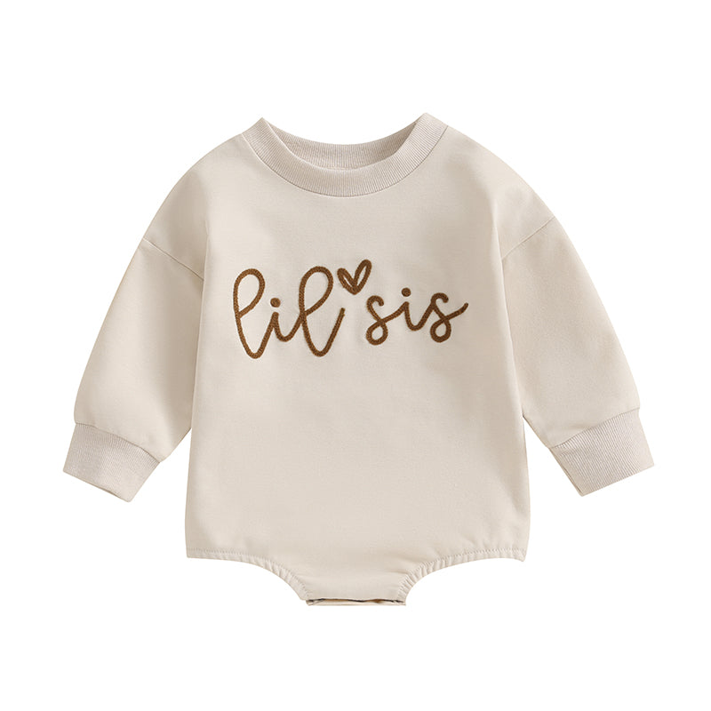 Clean flat lay of the long-sleeve infant bubble romper with brown Lil Sis graphic text.