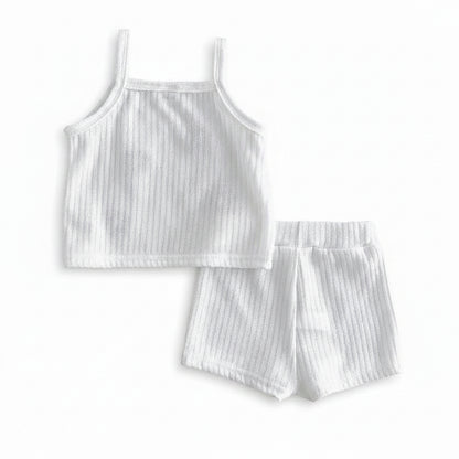 Flat lay arrangement showcasing the back view of the marshmallow white sleeveless ribbed top and coordinating baby shorts.