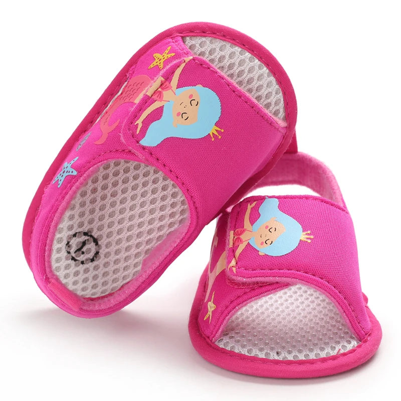 op-down view of hot pink baby girl mermaid sandals showing the inner mesh lining and toe design.