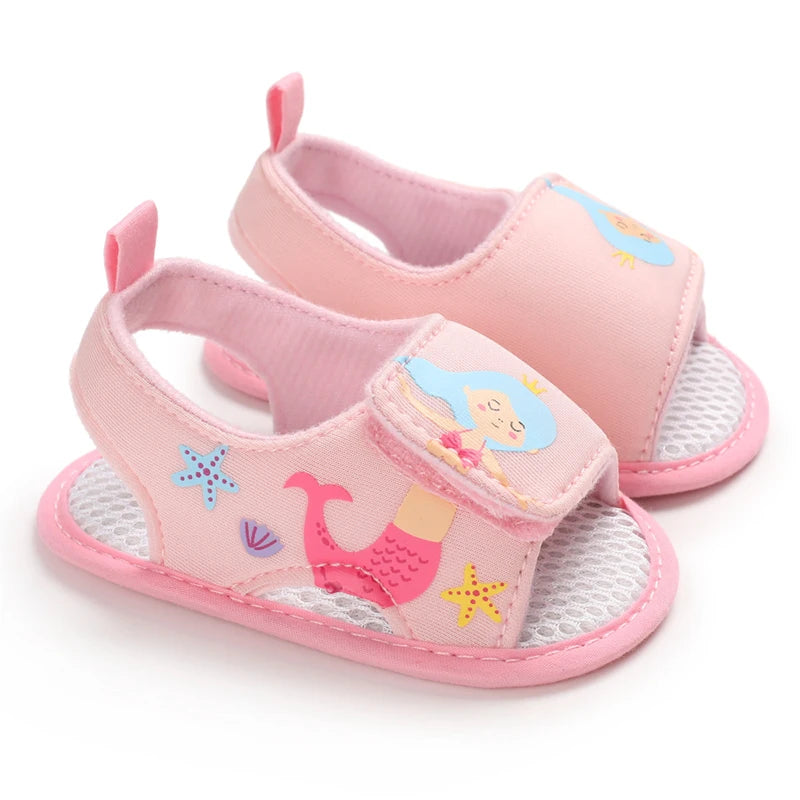 Pair of light pink baby girl mermaid soft sole sandals for first walkers.