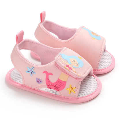 Pair of light pink baby girl mermaid soft sole sandals for first walkers.