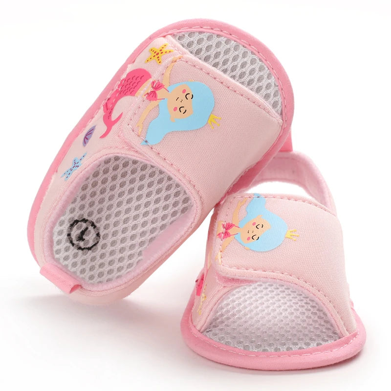 Top-down view of light pink baby girl mermaid sandals showing the inner mesh lining and toe design.