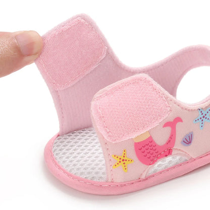 Light pink baby girl mermaid sandal showing the open hook-and-loop velcro strap.