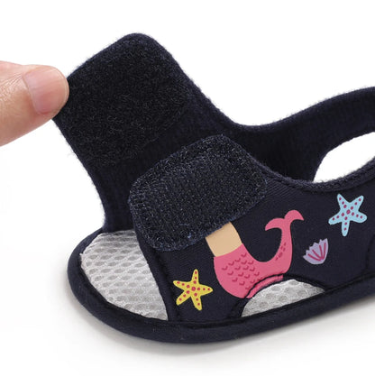 Navy blue baby girl mermaid sandal showing the open hook-and-loop velcro strap.