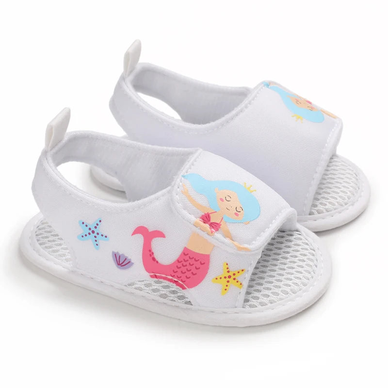 Pair of white baby girl mermaid soft sole sandals for first walkers.