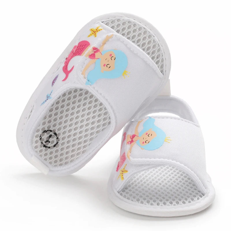 Top-down view of white baby girl mermaid sandals showing the inner mesh lining and toe design.