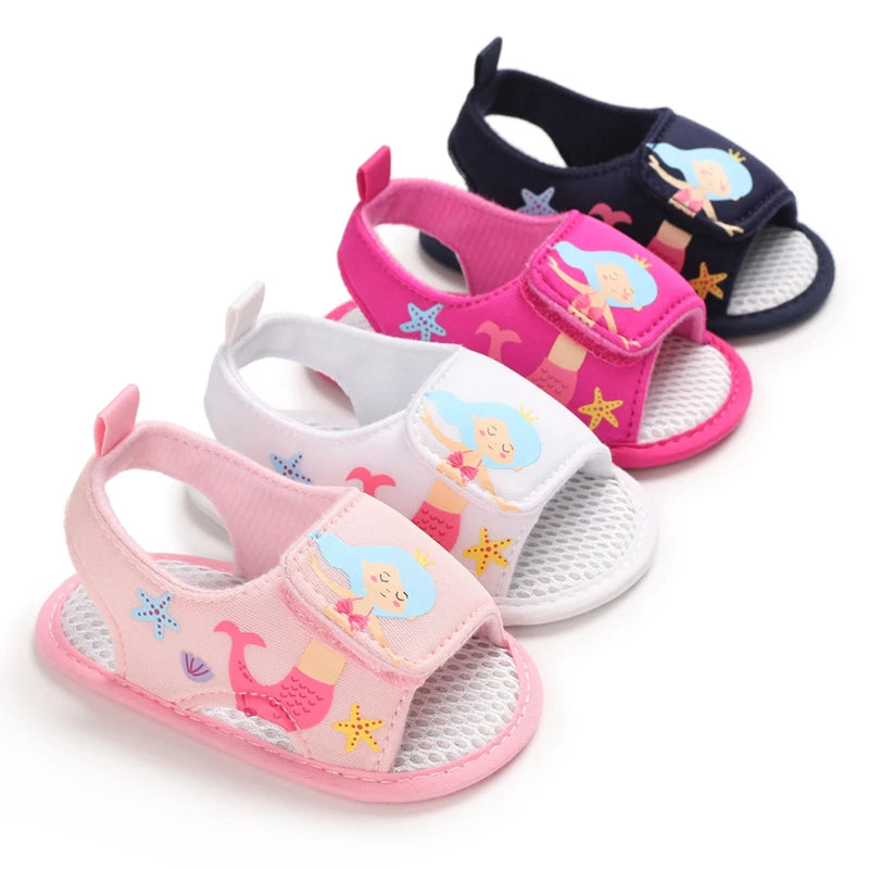 Four pairs of baby girl soft sole sandals featuring a mermaid design in navy blue, hot pink, white, and light pink.