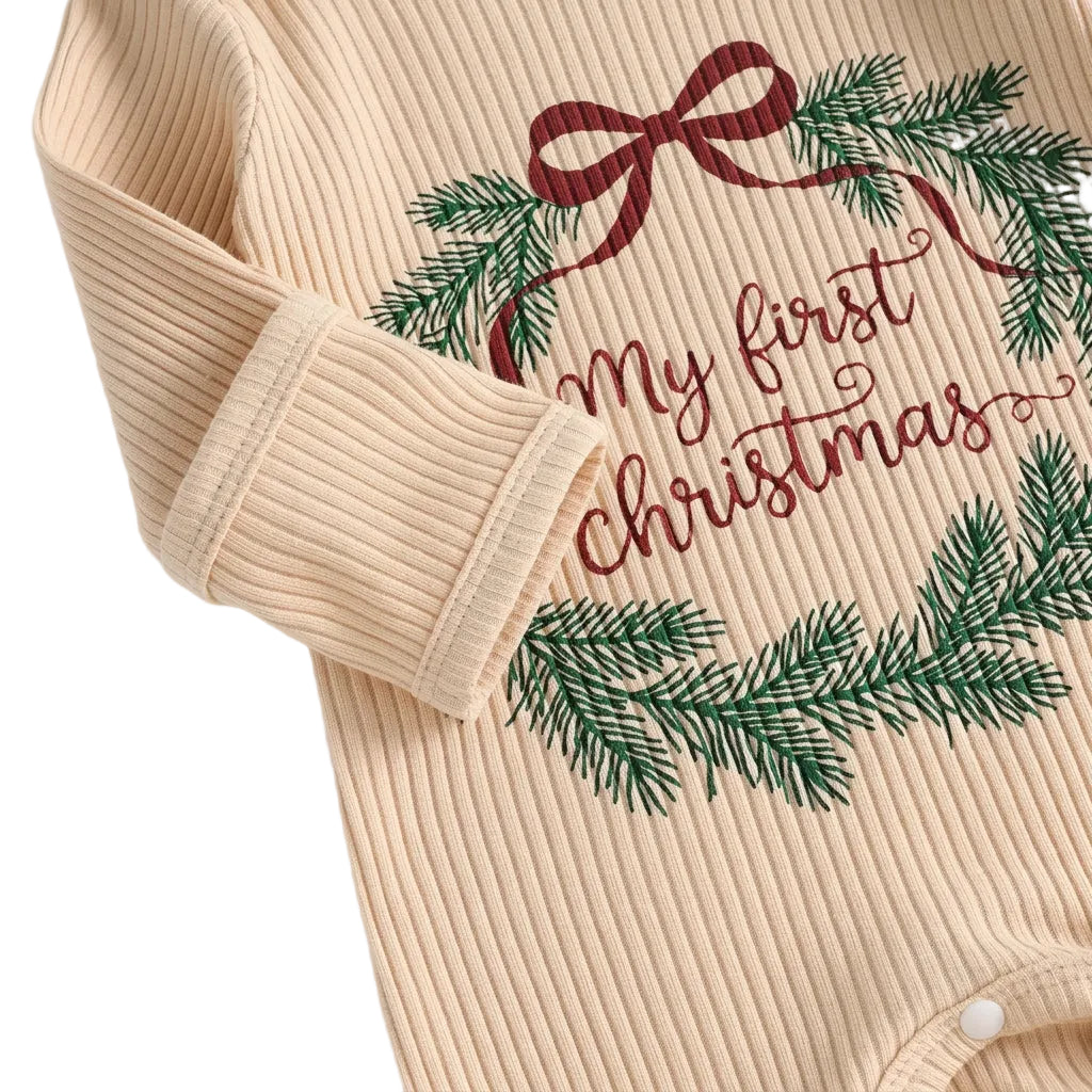 Detailed close-up view of My First Christmas wreath print on cream ribbed fabric