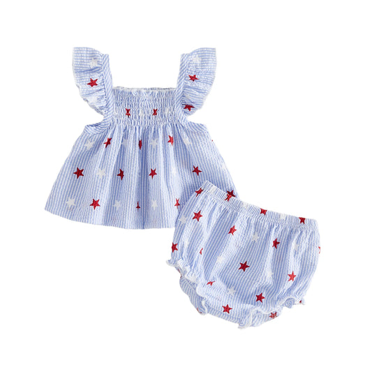 Baby girl 4th of July outfit featuring a blue striped seersucker smocked top and matching bloomer shorts with red and white stars.