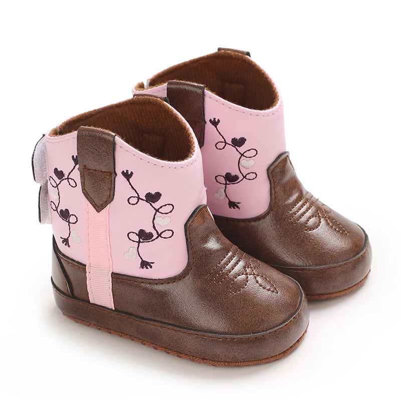 Two-tone pink and brown baby girl cowboy boots with heart embroidery, showing the main front and side design.