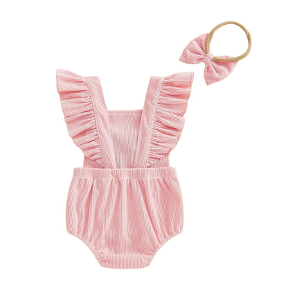 Back view of pink baby girl flutter sleeve corduroy romper showing crossover straps