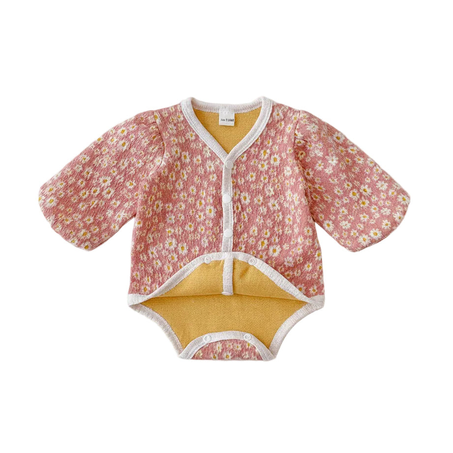 Full front view of the pink daisy floral baby bubble romper displayed flat on a white background.