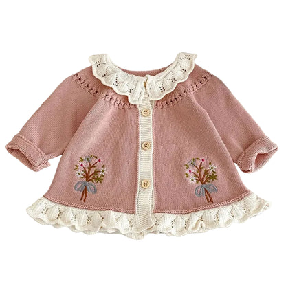 Pink embroidered knit cardigan for baby and toddler girls featuring a white scalloped ruffle collar and button front.